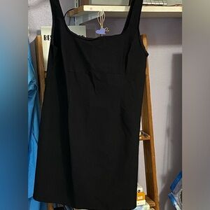 H&M’s Black tank mini dress. Side zipper. Lacy detail  on sleeve.